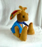 Lupin, a 16" fleece unjointed rabbit with neckerchief and knitted waistcoat. - Image 2