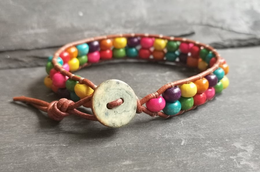 Leather bracelet with rainbow wooden beads and button fastener, Pride