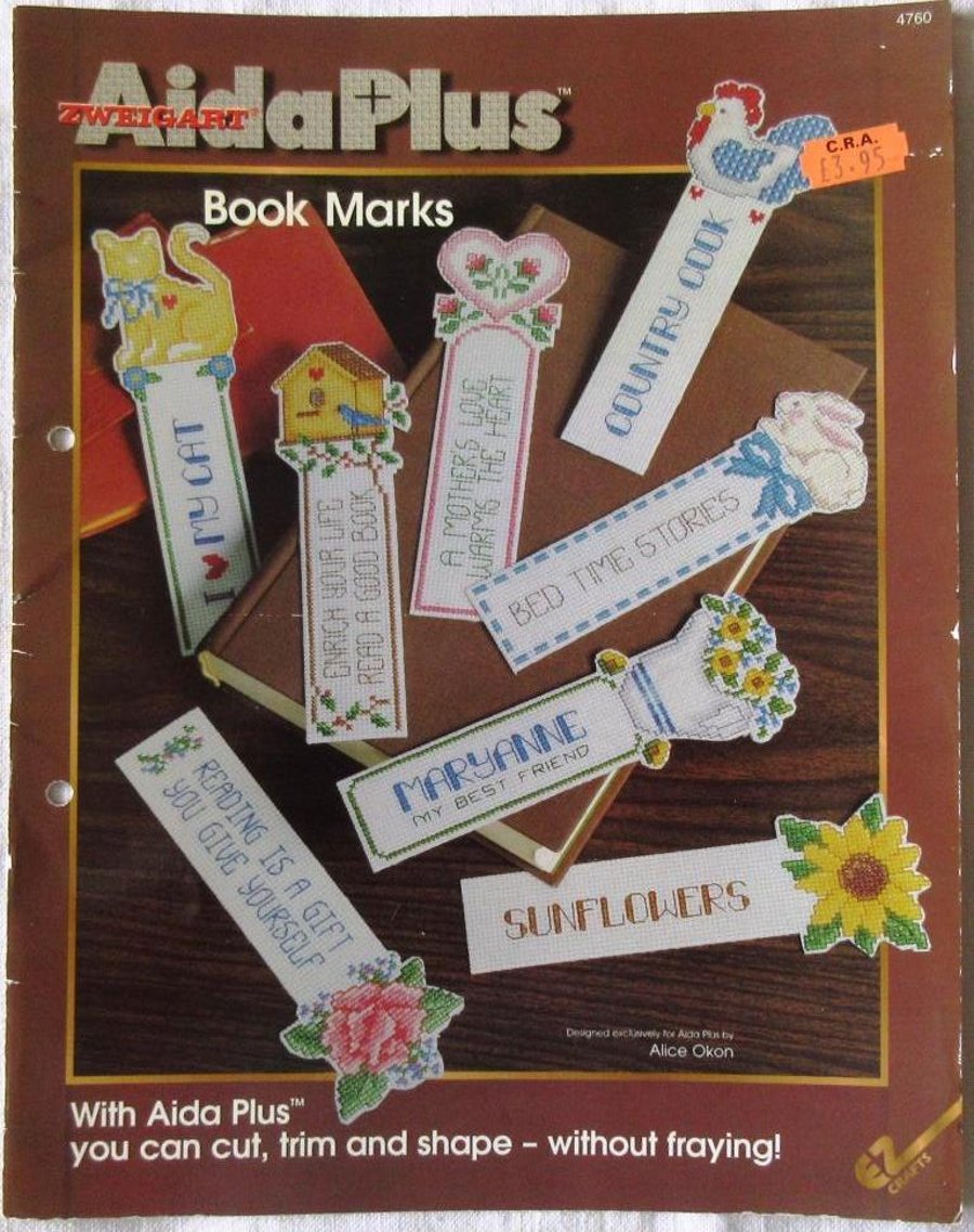 A booklet of cross stitch designs for bookmarks in Aida Plus fabric