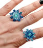 Blue beaded snowflake adjustable rings