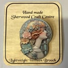 Art Nouveau wooden brooch. 