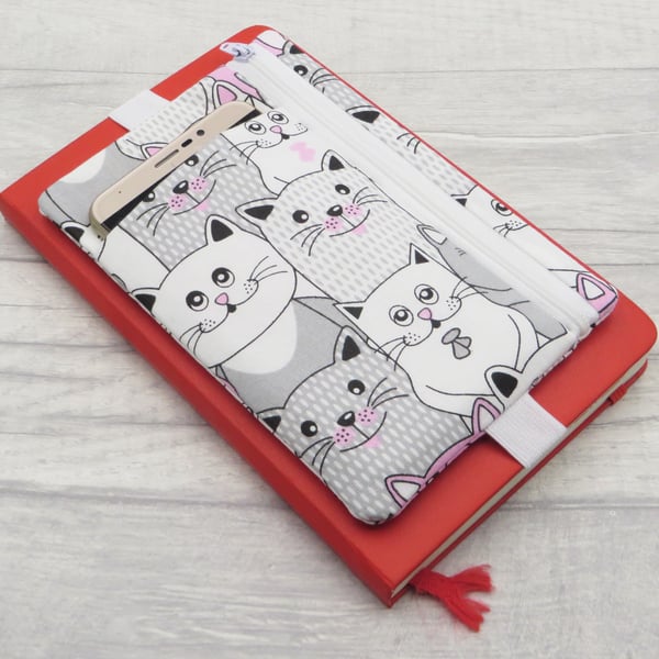 Planner pouch with zipped pocket and band.