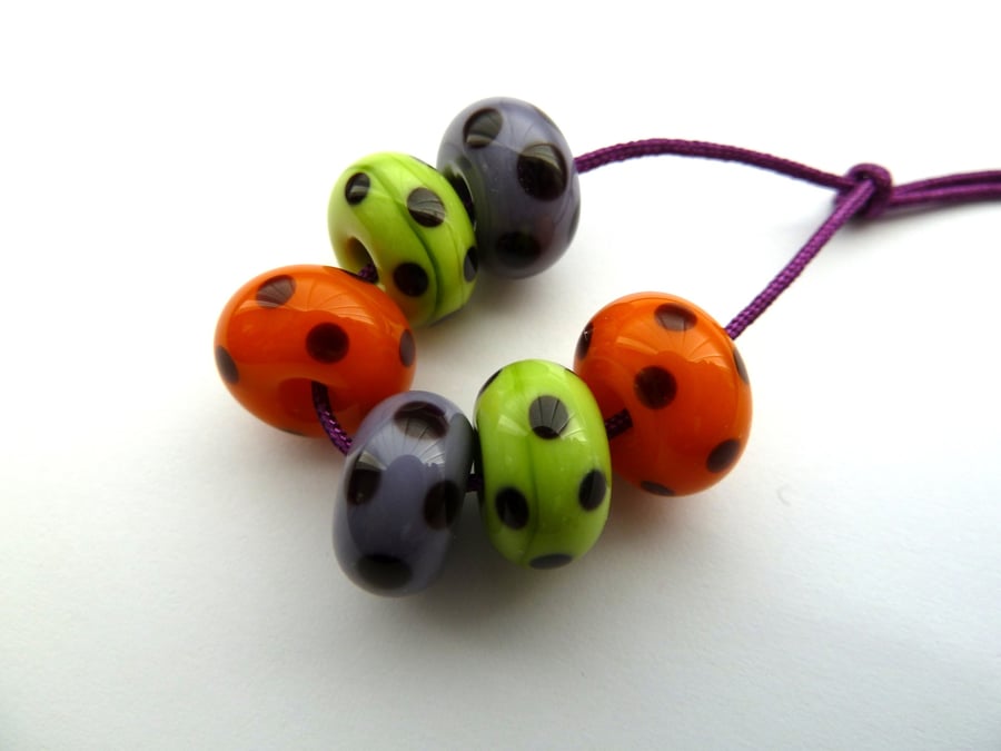 orange, purple and green spotty lampwork beads