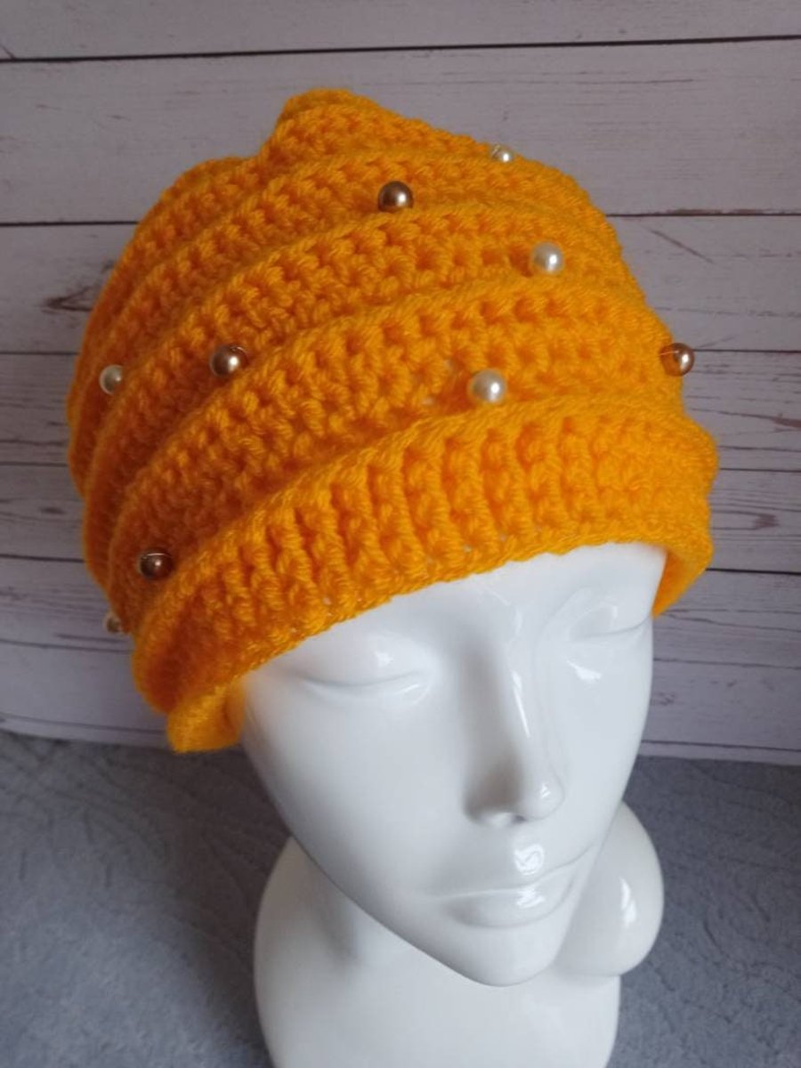 Crochet beanie hat with golden beads 