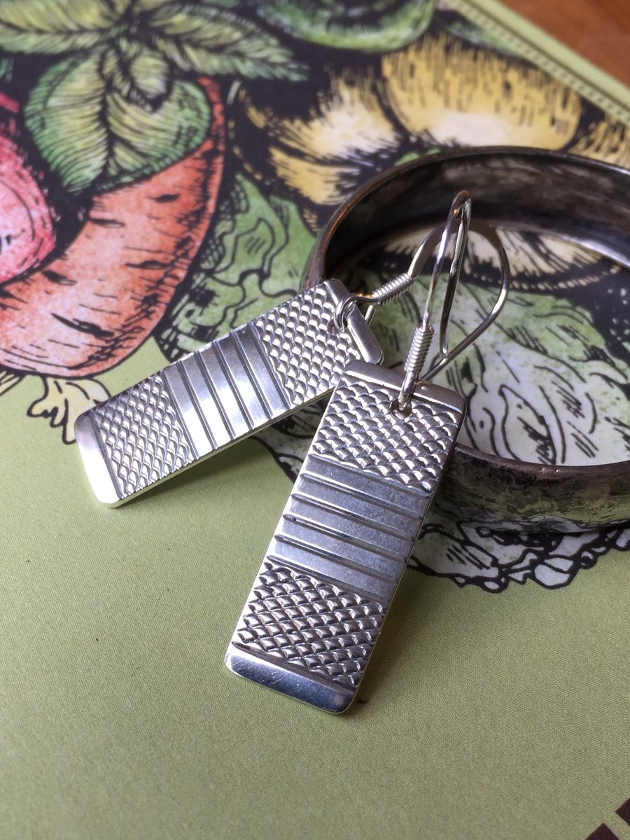 Oblong earrings made from a 1953 Sheffield silver napkin ring