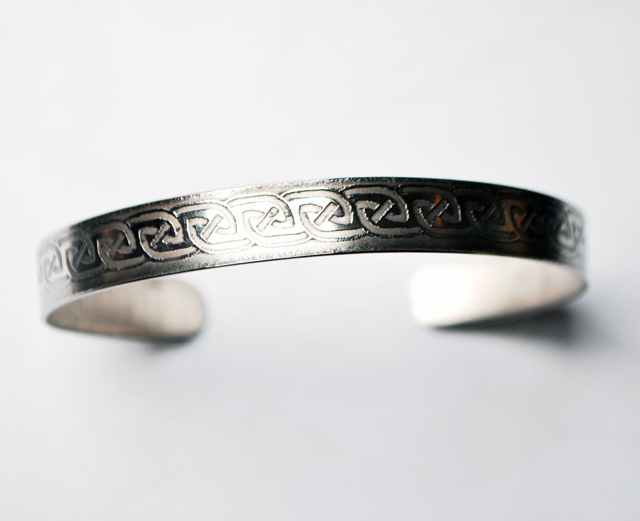 Steel celtic loop in loop cuff band bracelet, narrow band