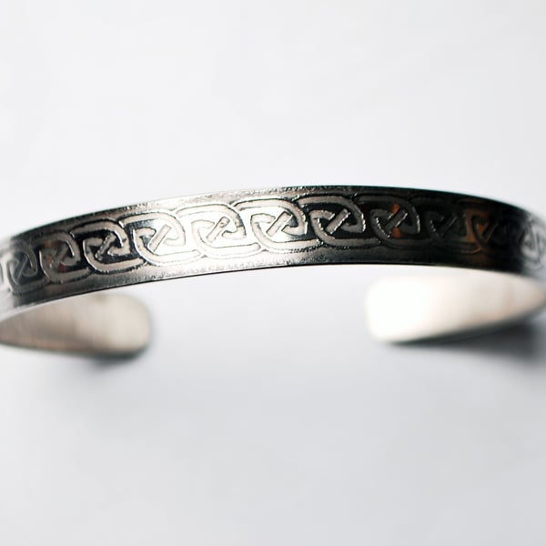 Steel celtic loop in loop cuff band bracelet, narrow band