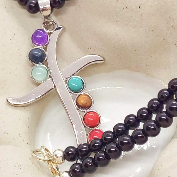 Stylised Cross Pendant with Chakra Stones on a Black Beaded Necklace