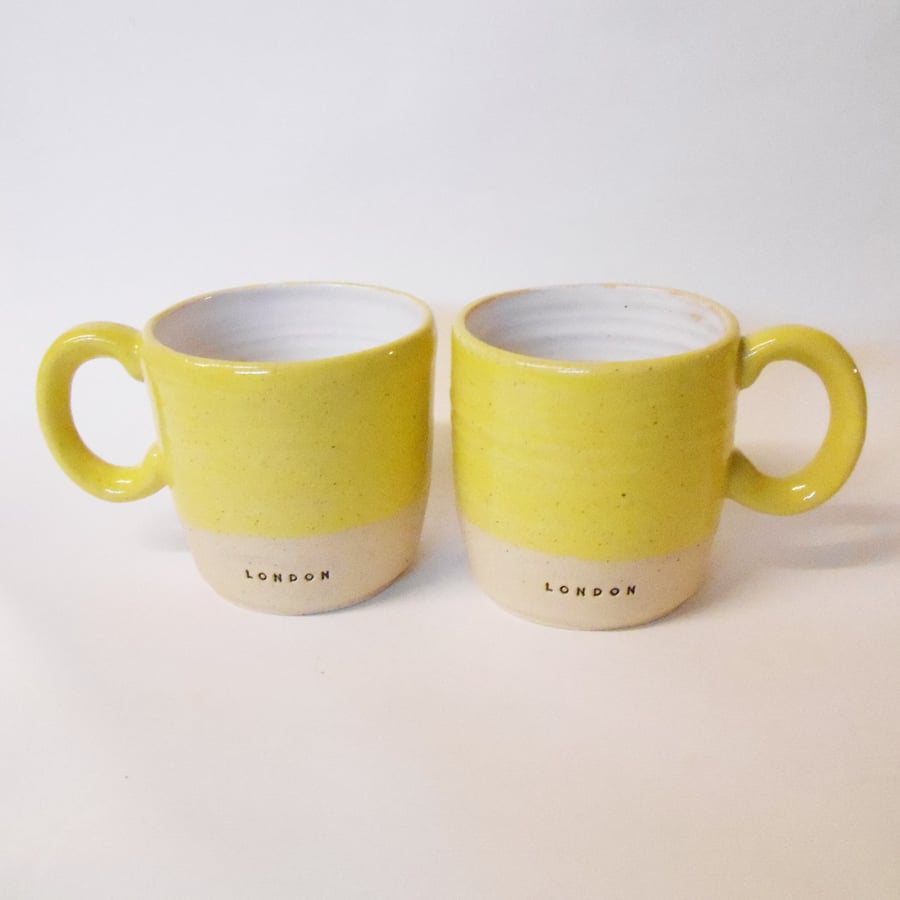 Mugs "London" logo Set of Two Speckled Yellow glaze.