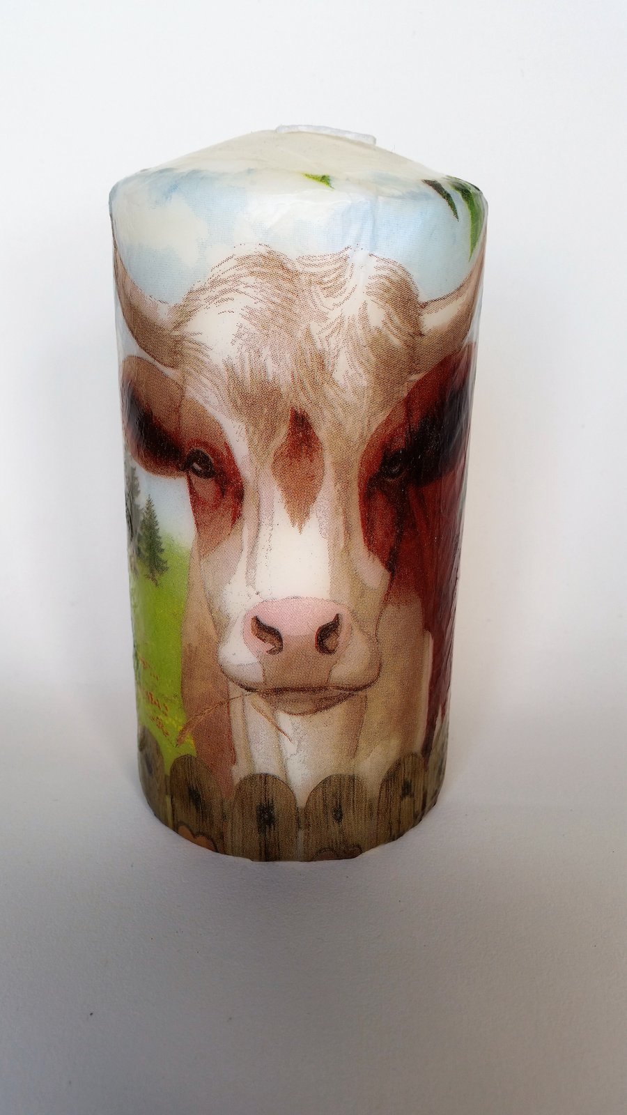 decorated cow candle