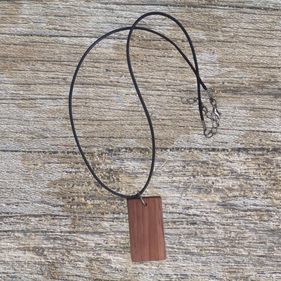 Handmade wooden pendant is crafted from reclaimed teak