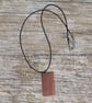 Handmade wooden pendant is crafted from reclaimed teak