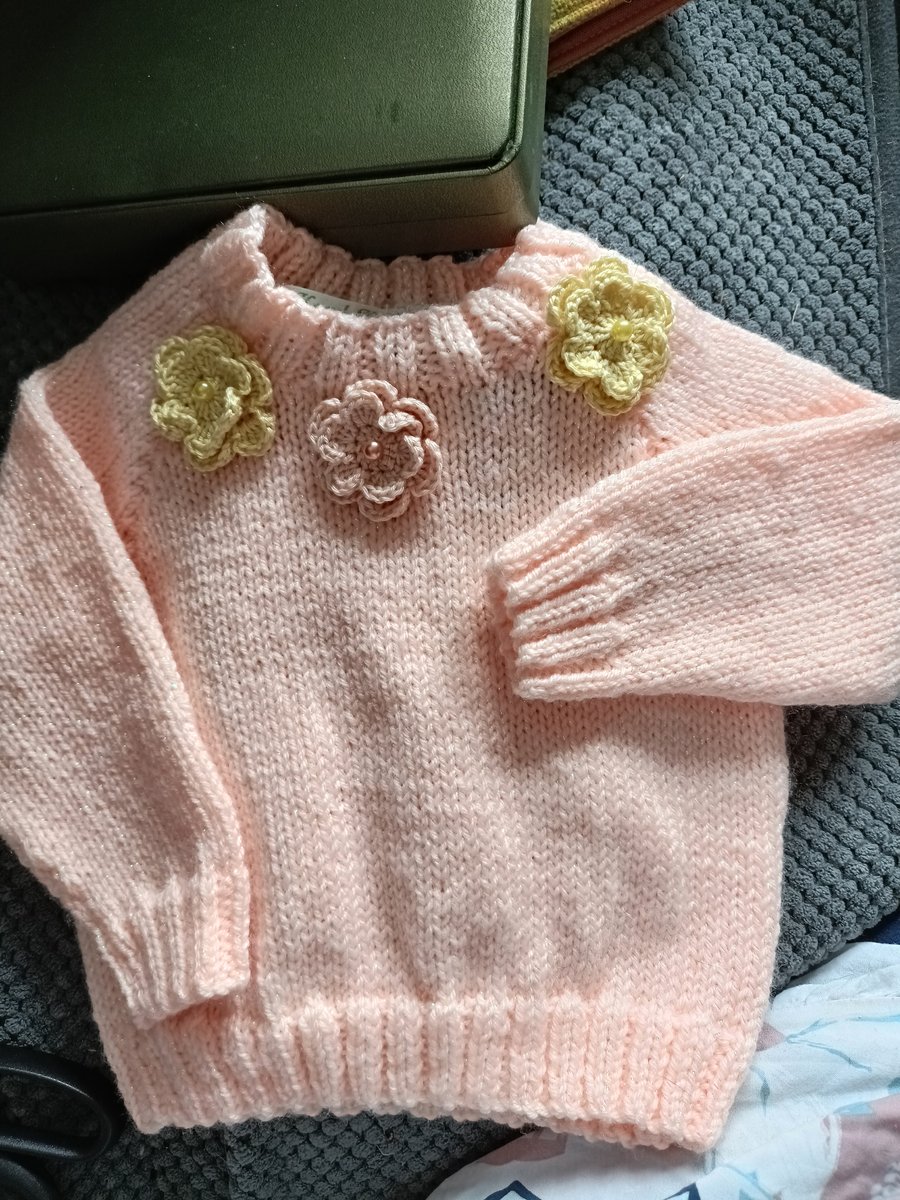 Hand Knitted childrens peach coloured jumper