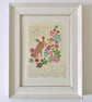 Cute Bunny Amongst Flowers, an original textile and mixed media framed art piece - Image 1