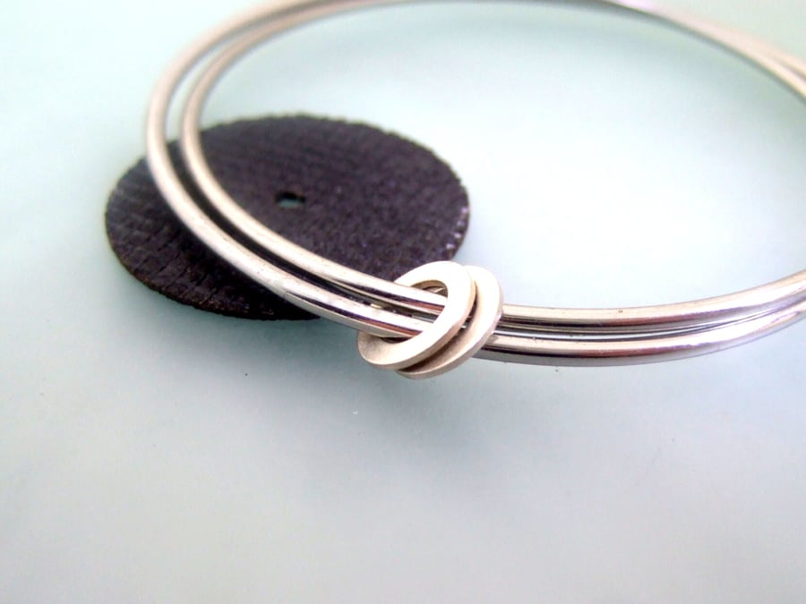 2 bangles with 2 flat hoops
