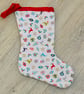 Hanging Christmas Stocking with scattered Christmas motifs. - Image 2
