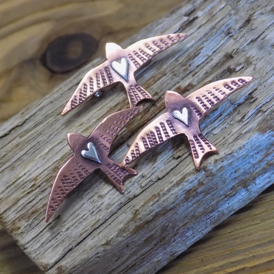 Copper and silver mixed metals swift brooch 