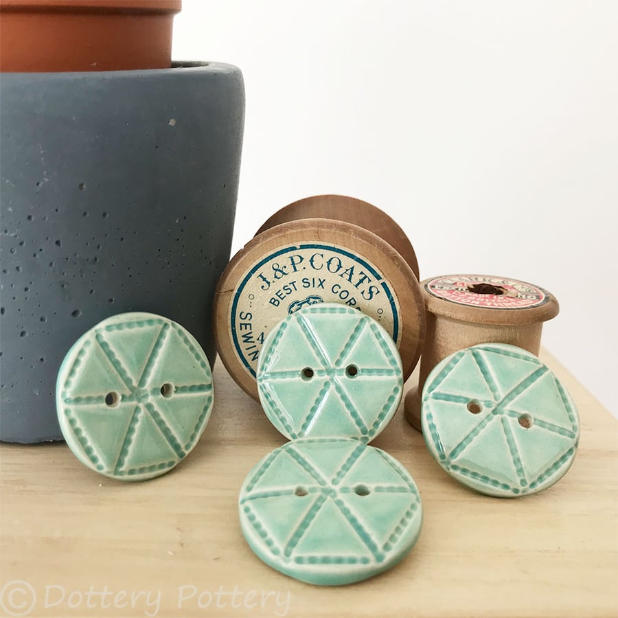 Set of four bright turquoise ceramic handmade buttons