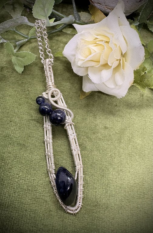 Silver wire wrapped Blue Goldstone pendant
