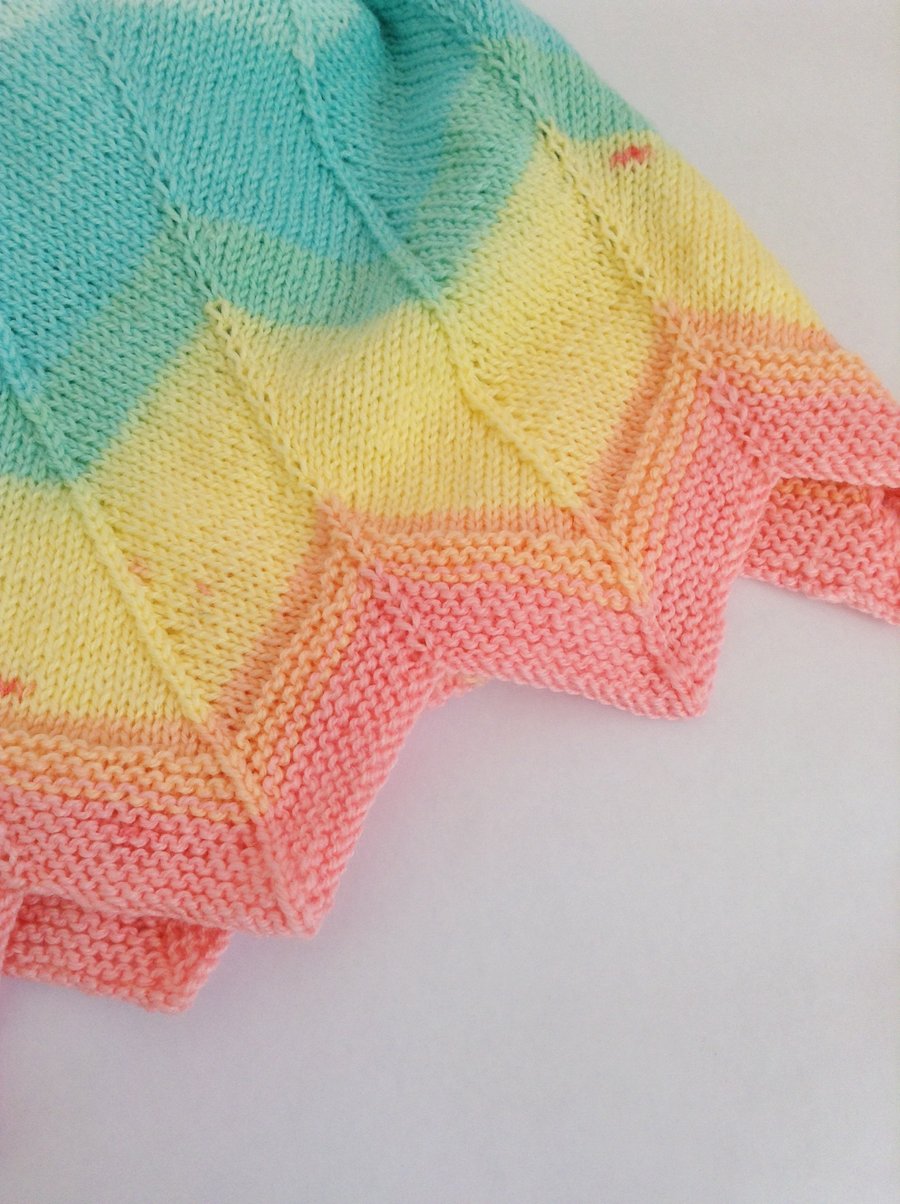 Rainbow striped hand-knitted baby blanket