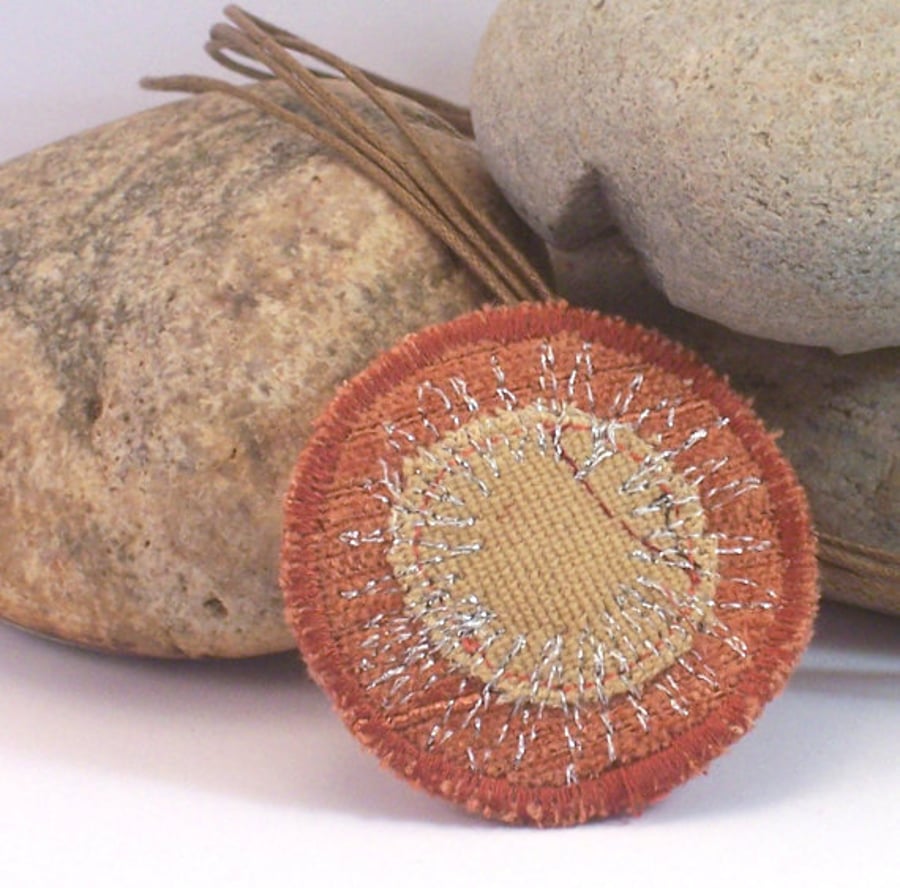 Round fabric necklace with silver thread machine embroidery