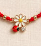 Red Macramé Bracelet with Daisy and Ladybird Charms – Adjustable - Image 3