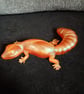 Handmade epoxy resin gecko ornament. Orange shimmer