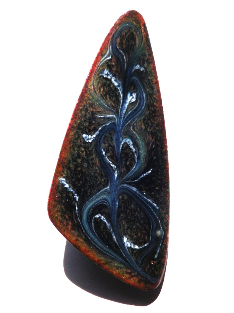 triangular brooch - scrolled dark blue and white on black over clear enamel