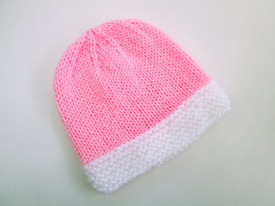 Hand knitted baby hat in pink and white, 100% acrylic, new baby gift
