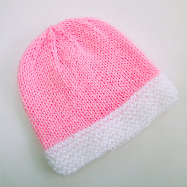 Hand knitted baby hat in pink and white, 100% acrylic, new baby gift