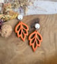 Autumn Minimalist Cutout Metallic Orange Polymer Clay Leaf Earrings - Image 3