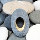 Pebble pendant necklace, nature inspired with a golden hollow centre.