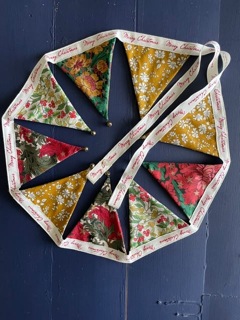 'Flowers and stars' Liberty fabric mini 'dresser' bunting with jingle bells