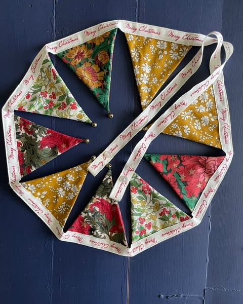 'Flowers and stars' Liberty fabric mini 'dresser' bunting with jingle bells