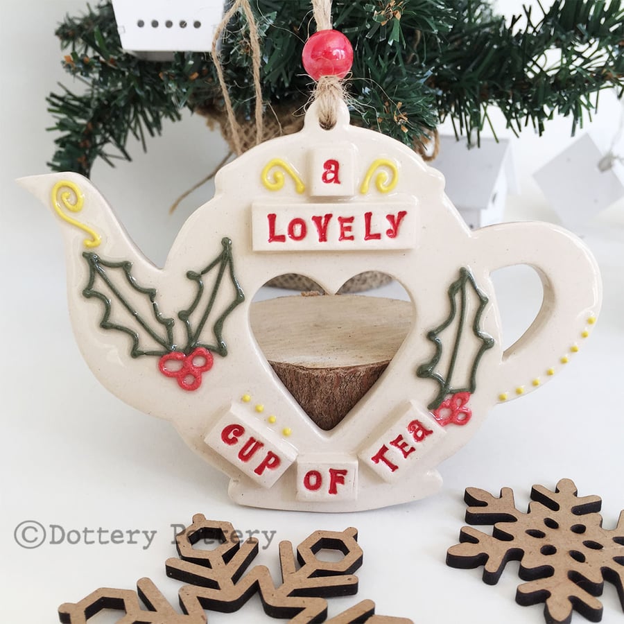 Pottery teapot decoration with a festive design