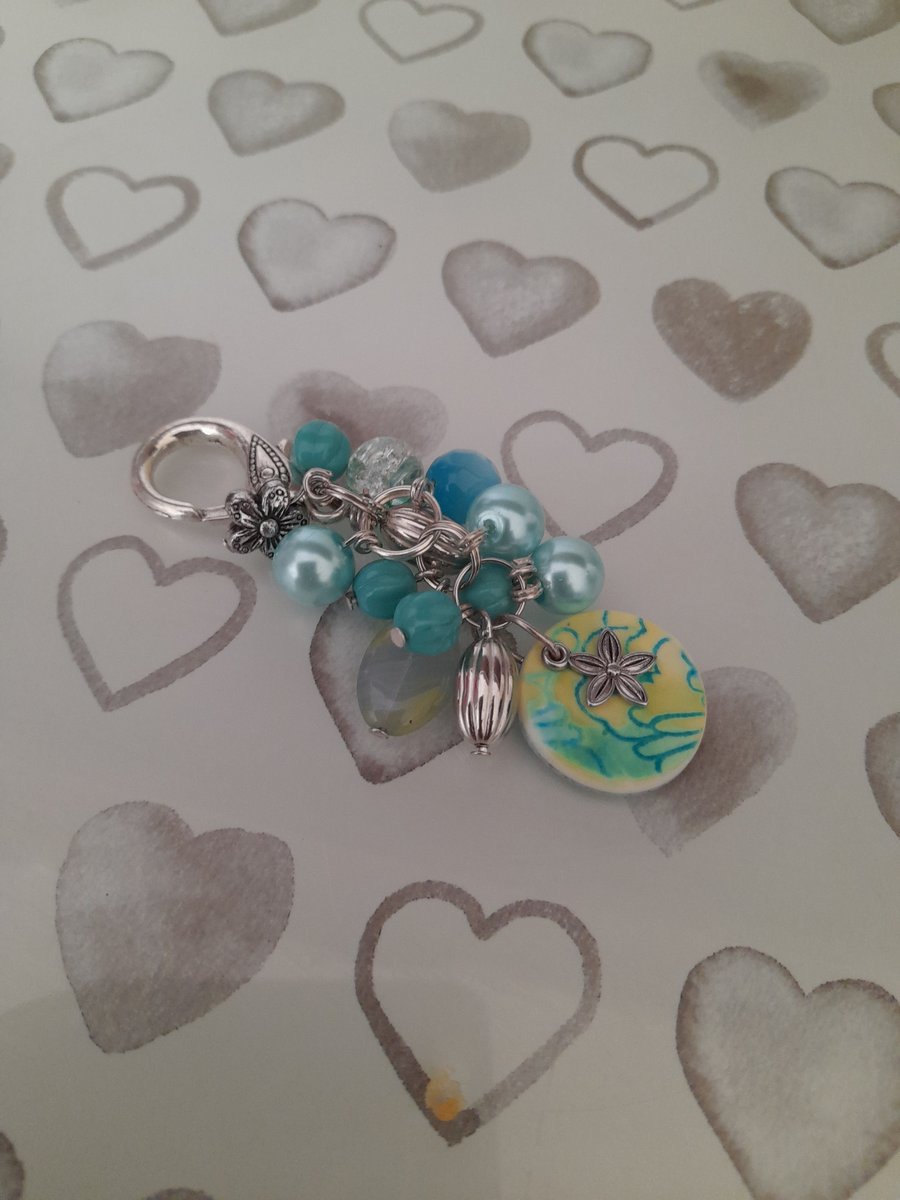 SHADES OF TURQUOISE, TEAL, PALE GREEN AND SILVER HANDBAG CHARM.