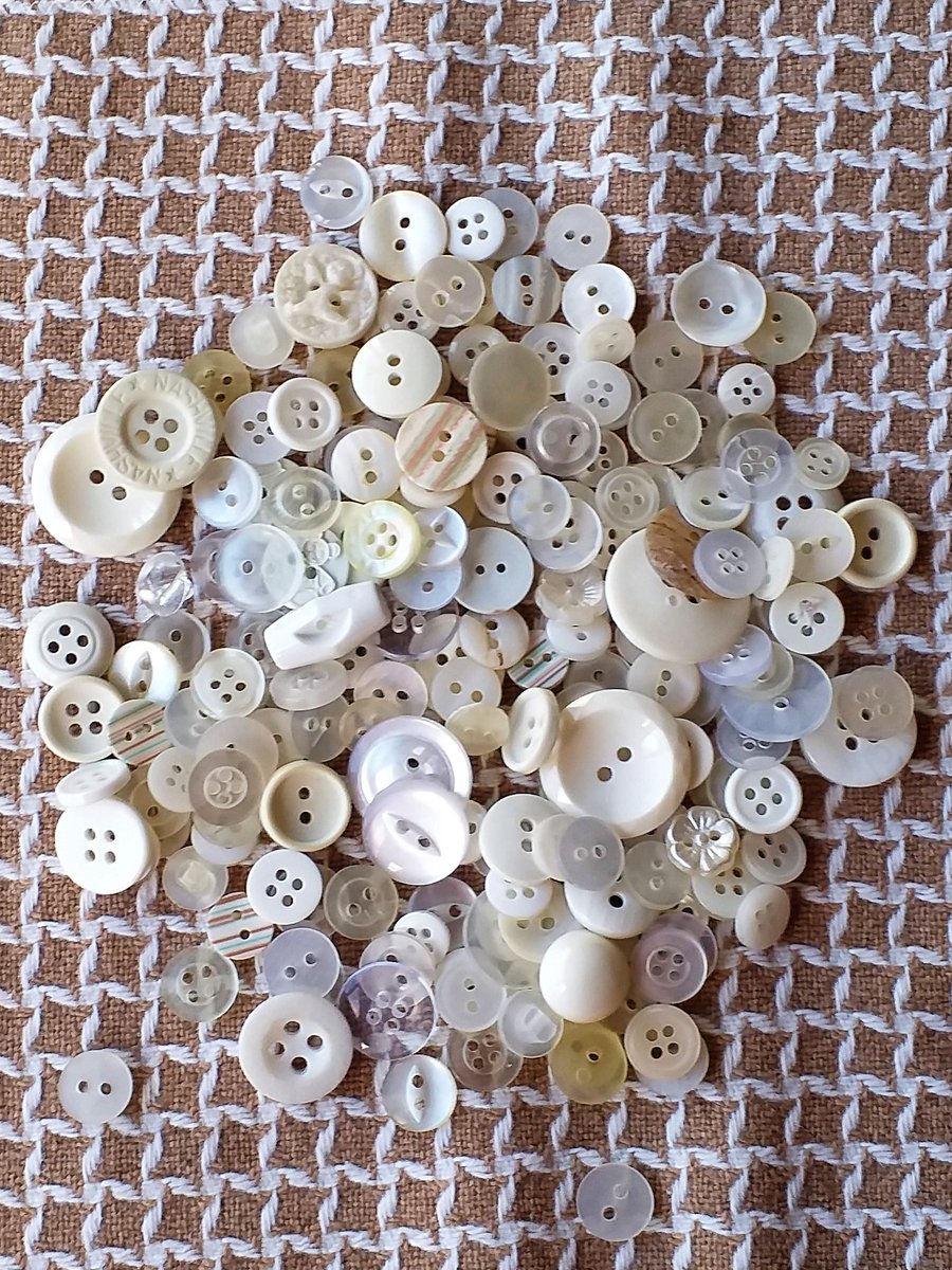Assorted white buttons