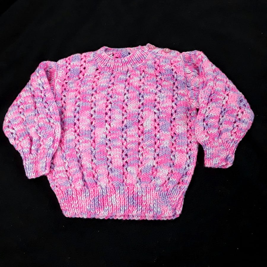 Baby jumper hand knitted in purples and pinks 6 - 12 months