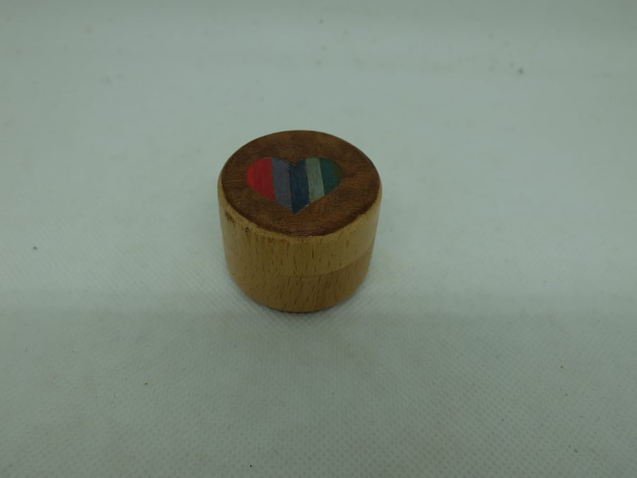 Small round wooden pot with colourful veneered lid