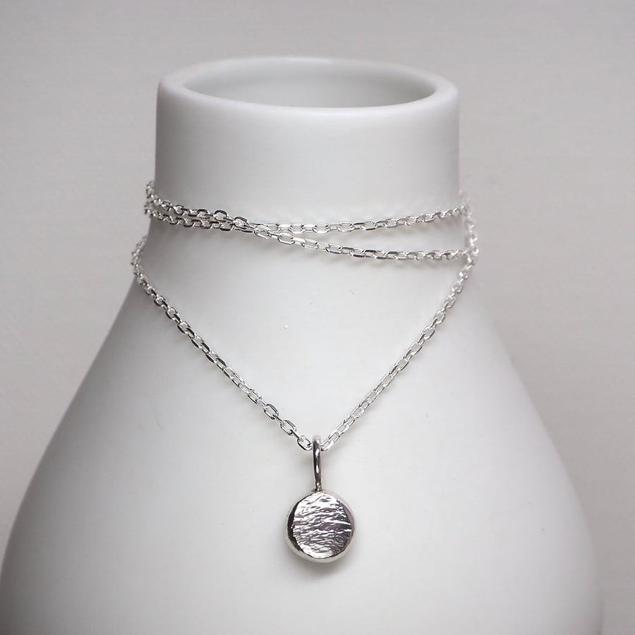 Shimmer silver pebble pendant necklace.