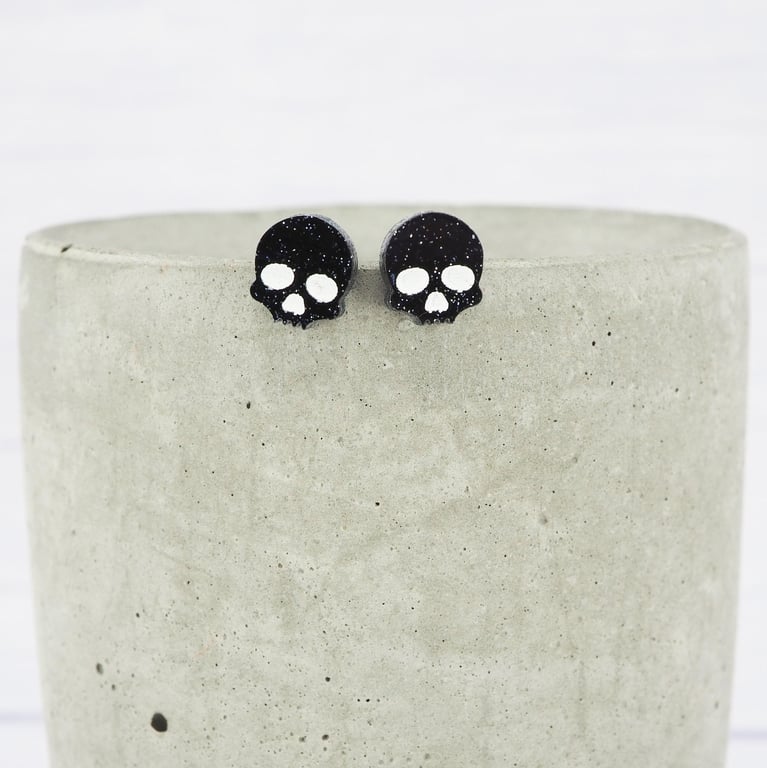 Titanium posts - Black glitter acrylic small skull stud earrings