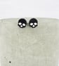 Titanium posts - Black glitter acrylic small skull stud earrings - Image 1