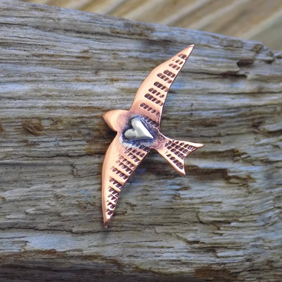 Copper and silver mixed metals swift brooch