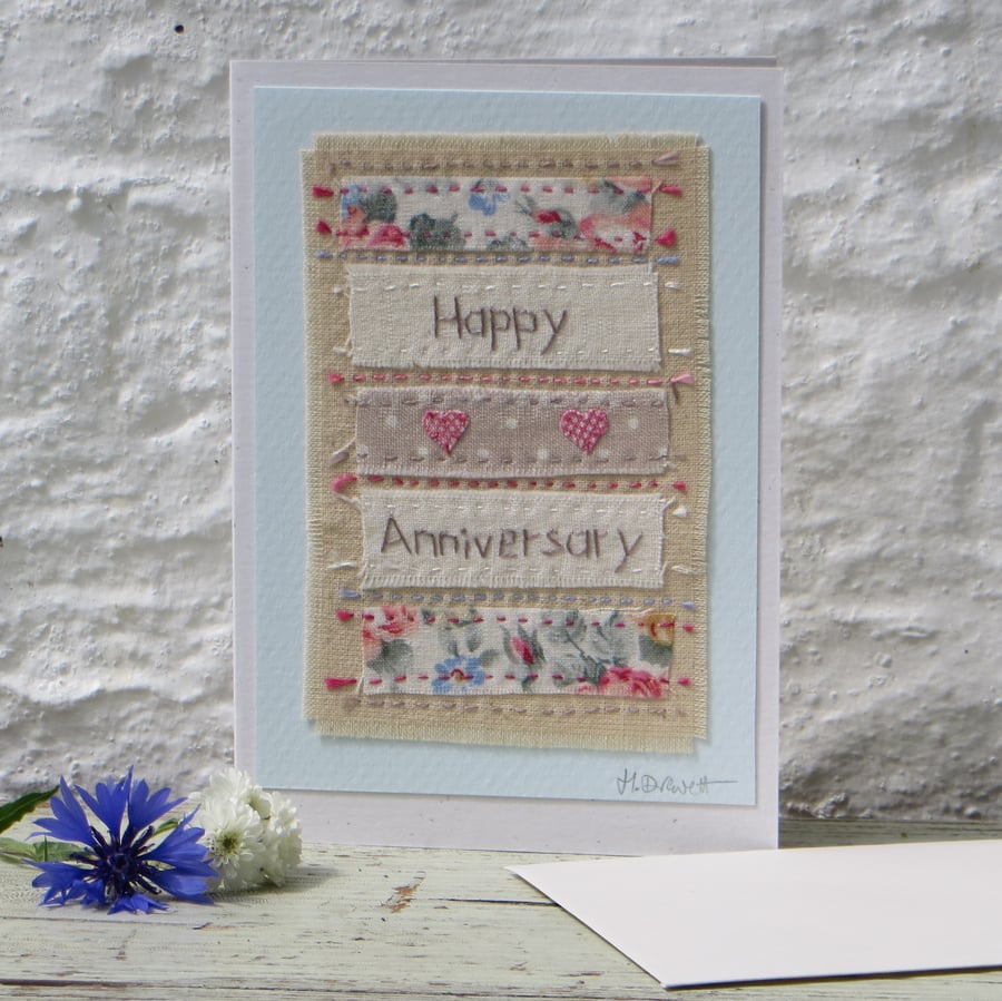 Hand-stitched, pretty little card with two applique hearts and recycled cottons