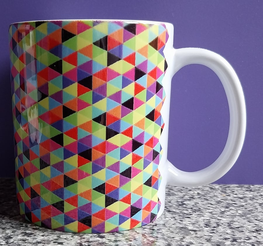 White Ceramic Mug with Multi Coloured Geometric Design