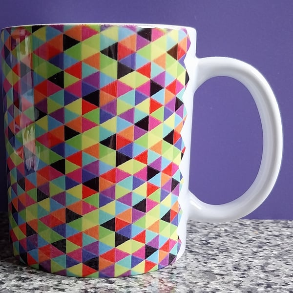 White Ceramic Mug with Multi Coloured Geometric Design