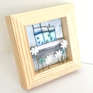 Winter houses, little fabric houses in a small wooden frame