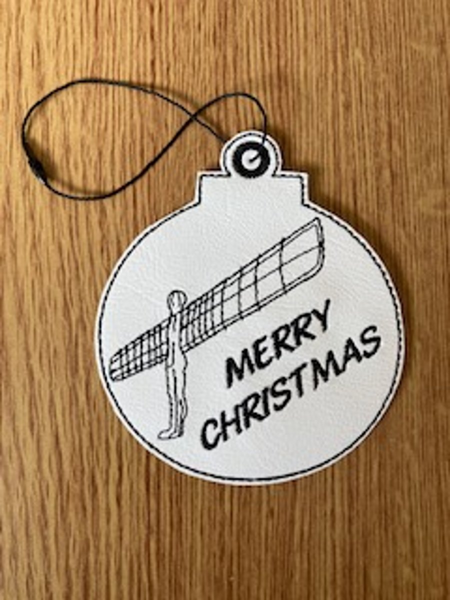 1112. Angel of the North Merry Christmas tree hanging decoration.