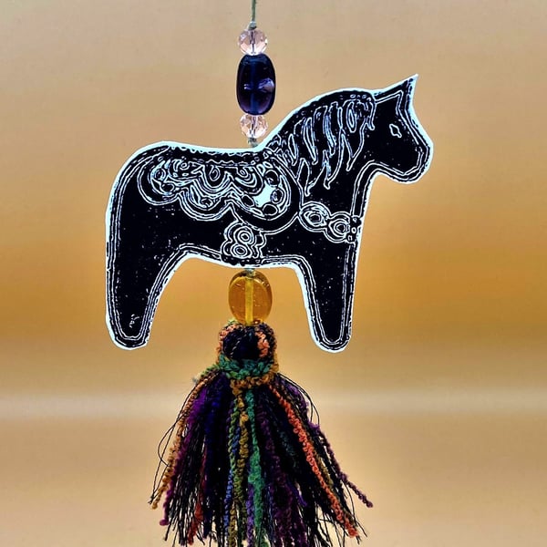 Swedish Dala Horse Christmas decoration with hanging tassel and special beads .