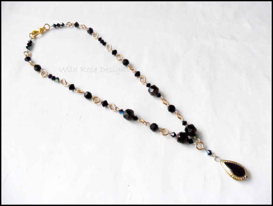 Black pendant necklace. 